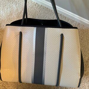 Haute Shore Grayson neoprene tote. Beige with darker, gray, and silver stripe.